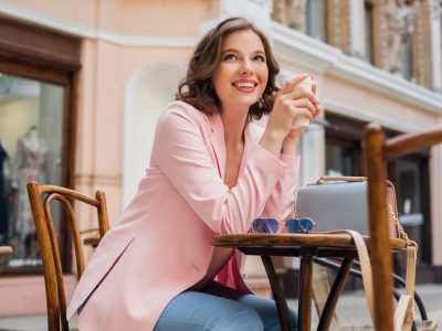 Beautiful,Smiling,Woman,In,Stylish,Outfit,Sitting,At,Table,Wearing